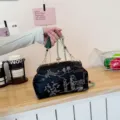 Elegant black embroidered party clutch bag with green bead handle and silk tassel - Black
