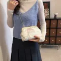 Elegant Chinese embroidery crossbody bag with vintage metal clasp and beaded strap - Off White