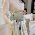Elegant light blue Chinese style embroidered kiss-lock bag with beaded strap and tassel. - Green