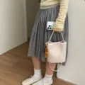 Stylish off-white soft leather bucket bag with woven pattern and wooden bead charm for women - Pendant Style / Off White