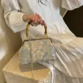 Elegant light blue embroidered floral evening bag with bamboo handle and gold chain - Bamboo Handle Style / Blue