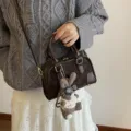 Elegant dark brown mini pillow crossbody handbag with a cute plush rabbit charm - With Charm / Coffee