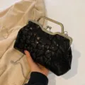 Elegant black sequined clutch bag with metal clasp and chain strap for evening events. - Black