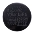 Black round tinplate badge featuring motivational Live Your Life and Forget Your Age text - Live YOUR LIFE Trendy Text (MXZ058)