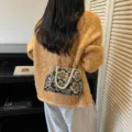 Black embroidered floral evening clutch bag with pearl handle and golden clasp design - Pearl Handle Style / Black