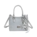 Light blue denim bucket bag with silver metallic handles and star charm accessory. - Light Blue Rhinestone (With Charm) / With Pendant