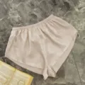 Elegant champagne gold satin lounge shorts with elastic waistband and side slits - S / Bottoms / Khaki