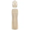 Top corto beige senza maniche con cut-out e catena di perle, abbinato a una gonna lunga. - Taglia M / Sopra E Sotto / Albicocca