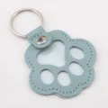 Light blue-grey leather paw-shaped keychain and pet memorial tag with metal ring - 1 Piece / Blue