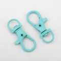 Two cyan painted alloy swivel lobster clasps for DIY jewelry and bag accessories. - 10 Pieces Pack / 13x35mm / Teal Blue