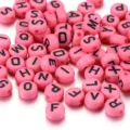 Pink acrylic round alphabet beads for DIY friendship bracelet and necklace making - 100 Pieces/Pack / Pink With Black Letters