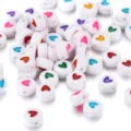 White acrylic round beads with colorful engraved heart patterns for DIY jewelry making - 100 Pieces/Pack / White With Colorful Hearts