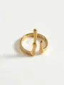 Gold stainless steel ring detail shot, abstract fluid line design, minimalist jewelry close-up. - Dripping Water Rings
