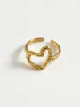 Close-up detail of modern minimalist hollow heart ring, geometric gold statement jewelry. - Dotted Irregular Heart Rings