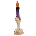 Detaillierte Makroansicht der Halloween-LED-Kerze mit Skeletthand und Totenkopf-Design - L / Lila