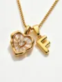 Gold stainless steel box chain necklace featuring mother of pearl heart and letter F pendant. - Letter F