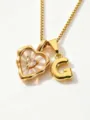 Detailed close-up of gold stainless steel heart mother-of-pearl necklace with letter G pendant. - Letter G