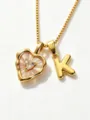 Gold stainless steel box chain necklace with mother-of-pearl heart pendant and letter K charm. - Letter K