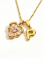 Close-up detail of the elegant gold heart mother-of-pearl and letter P pendant necklace. - Letter P