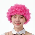 Leuchtend pinke lockige Afro-Perücke für lustige Bühnenauftritte und Clown-Kostüme - Einheitsgröße / Fuchsia