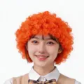 Leuchtend orangefarbene Afro-Perücke für Bühnenauftritte und lustige Cosplay-Kostüme - Einheitsgröße / Orange