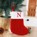 Festive red knitted Christmas stocking with white cuff and red embroidered letter N - Red (N)