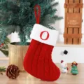 Cozy red knitted Christmas stocking with white cuff featuring red embroidered letter O - Red (O)
