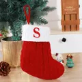 Red knitted Christmas stocking with white cuff featuring an embroidered red letter S - Red (S)