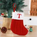 Cozy red knitted Christmas stocking featuring an embroidered letter T on a white cuff - Red (T)