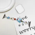 Detailansicht des weihnachtlichen Perlenarmbandes für Apple Watch mit Weihnachtsmann - 38/40/41/42mm / Blauer Weihnachtsbaum