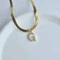Minimalist gold herringbone chain necklace with sparkling cubic zirconia letter G pendant. - Letter G
