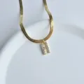 Gold herringbone chain necklace with sparkling cubic zirconia letter H pendant minimalist style. - Letter H
