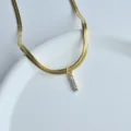 Gold snake chain necklace with sparkling zirconia letter pendant for women chic daily wear. - Letter I