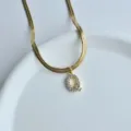 Gold stainless steel flat snake chain necklace with sparkling zircon letter Q pendant. - Letter Q