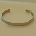 Stainless steel smooth open cuff bracelet, minimalist metallic silver detail view. - 6mm (70mm) / Silver