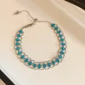 Silver-tone blue crystal mesh bracelet with adjustable sliding bead chain design. - Silver/Blue