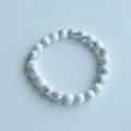 Close-up detail of natural white stone beaded elastic bracelet showing polished bead texture. - 2# Natural White Turquoise