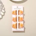 Stylish set of six 3cm mini macaron orange bow hair claw clips on a display card - 6 Pieces With Display Card / Pearlescent Light Orange