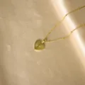 Gold stainless steel initial heart pendant necklace with sunburst texture variant. - Radiant Heart Initial I Necklaces