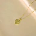 Gold stainless steel initial heart necklace featuring sun ray texture and letter S pendant. - Radiant Heart Initial S Necklaces