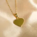 Gold heart pendant necklace detailed view, stylish stainless steel fashion jewelry for women. - Heart Style
