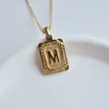 Gold stainless steel letter M pendant necklace detail view, fashion hip-hop jewelry accessory. - Letter M Square Pendant / Gold