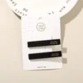 Elegant set of two black acetate duckbill hair clips on a white handmade card - 2-Piece Set (Card Packed) / Solid Black (Square)