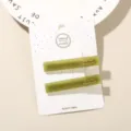 Elegant set of two olive green acetate hair clips presented on a white display card - 2-Piece Set (Card Packed) / Olive Green (Cube)