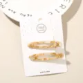 Elegant 2-piece set of cream marble acetate hair clips on a white display card - Hollow Oval (#3) / 2-Piece Set (Card Packed) / Creamy Floral