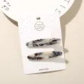 Elegant 2-piece acetate hair clip set featuring grey marble texture on display card - Hollow Oval (4) / 2-Piece Set (Card Packed) / Black and White Speckled