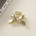 Elegant gold bow-shaped metallic hair claw clip designed for minimalist hair styling - Bulk Packaging / Ribbon Bow Gold