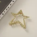 Elegant gold star-shaped metal hair claw clip with a stylish hammered texture finish - Star Gold