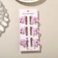 Set of six mini 3cm purple pearlescent bow hair claw clips presented on pink display card - 6 Pieces With Display Card / Pearlescent Light Purple