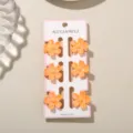 Set van 6 mini haarspeldjes in oranje bloemvorm op een displaykaart voor meisjes - Parelmoer Lichtoranje
